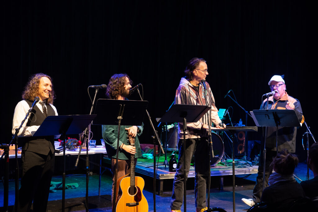 The contestants for Dan Barth's trivia contest listen to the host read a question