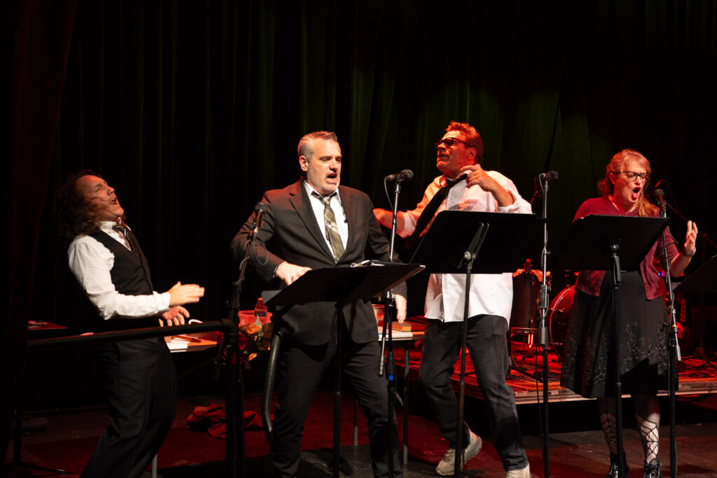 The crew of Shades Brigade reenact a fight scene on stage