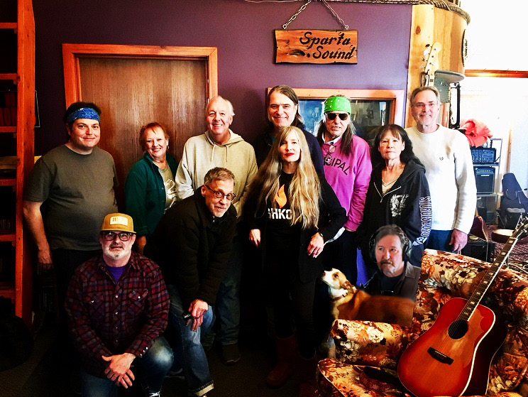 The members of the band Rangers stand together in a studio space