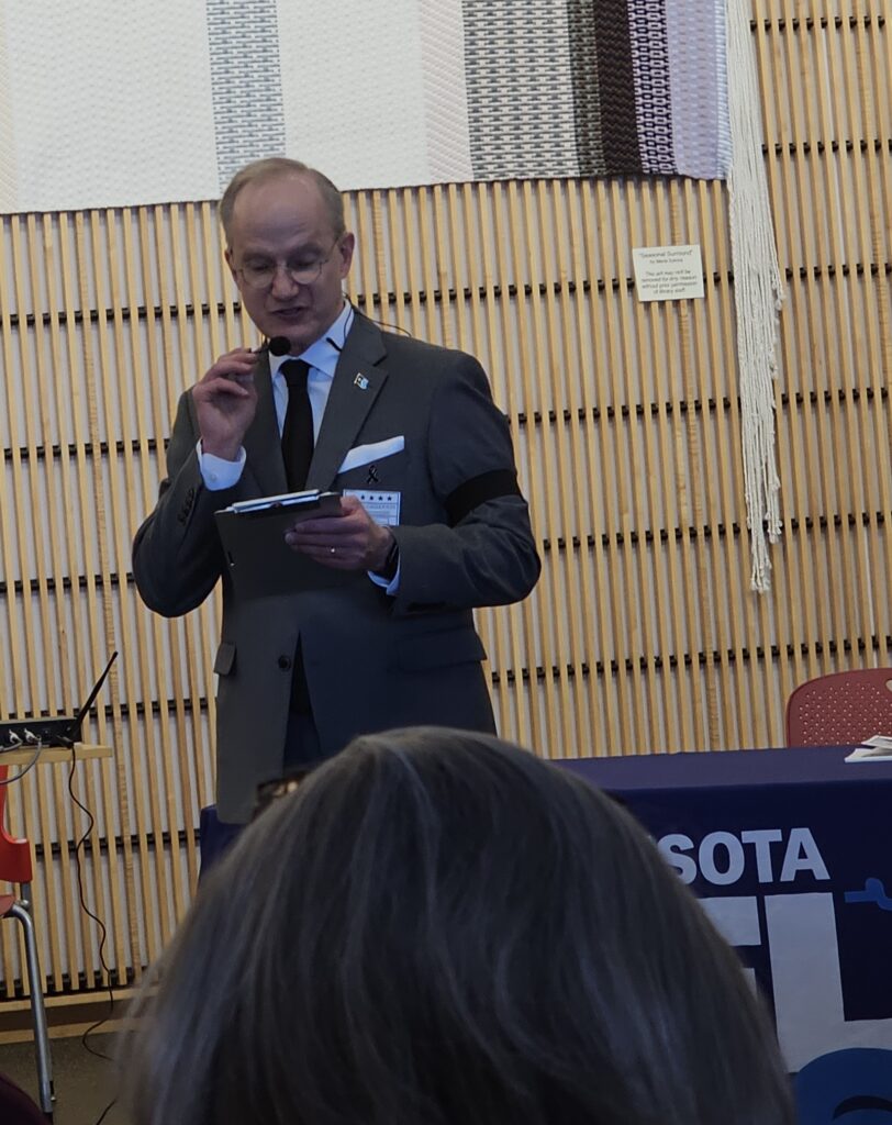 CD6 DFL candidate Anson Amberson speaks to the crowd during debate