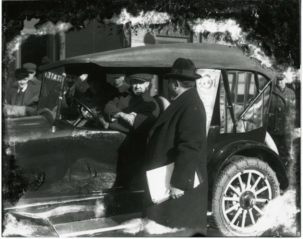 Pandolfo, Samuel shaking hands with Peffer, Anton in his Pan Car, Pan Motor Company, St Cloud (Minn)
