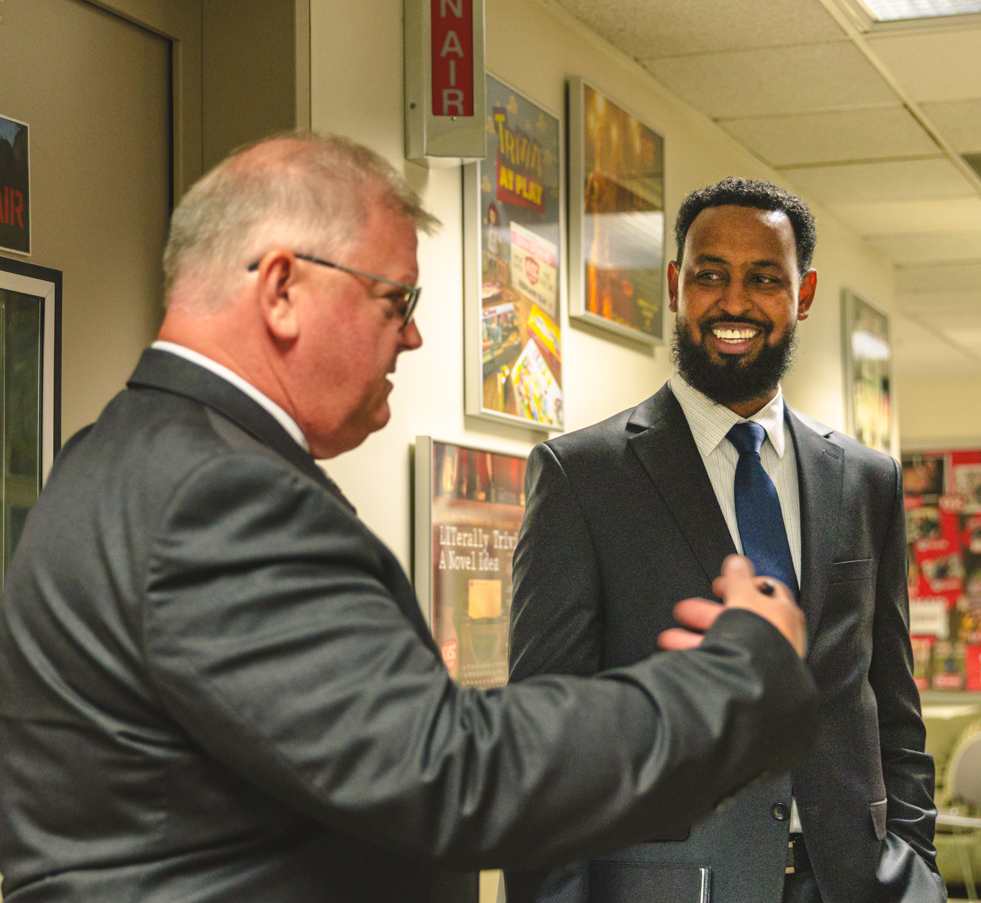 Candidates Republican Mike Conway (left) and DFL Abdi Saisane (right) talk prior to the debate on Thursday, Sept. 17