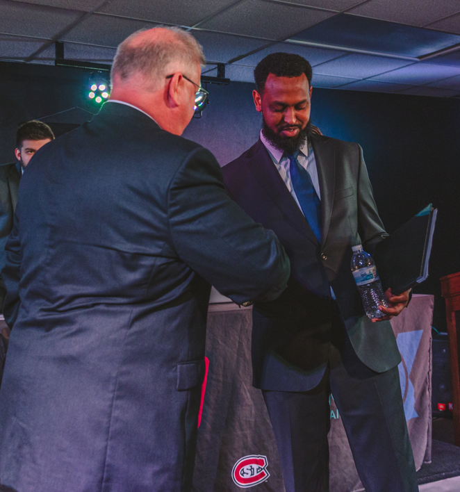 Mike Conway (left) and Abdi Daisane (right) shake hands in the KVSC Performance Studio at the end of their debate on Thursday, Sept. 17