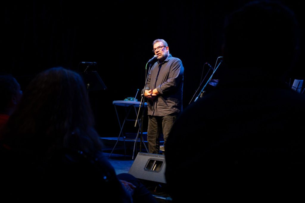 Lee Adams performs a monologue during Granite City Radio Theatre