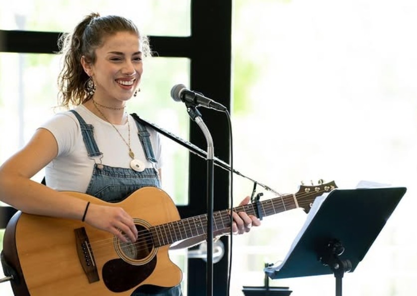 Kaatwalk performs with an acoustic guitar
